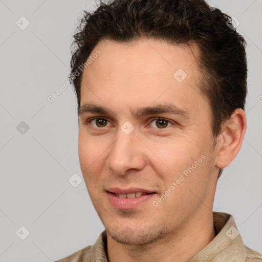 Joyful white adult male with short  brown hair and brown eyes