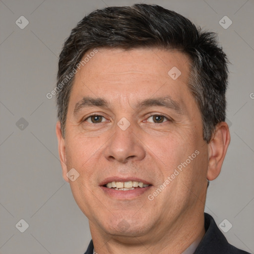 Joyful white adult male with short  brown hair and brown eyes