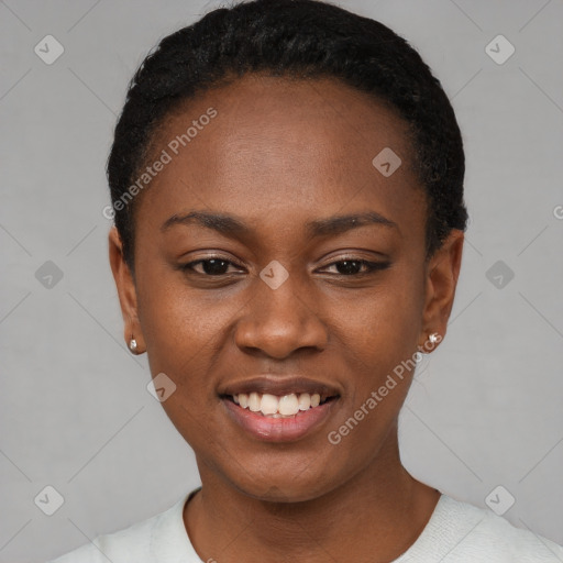 Joyful black young-adult female with short  black hair and brown eyes