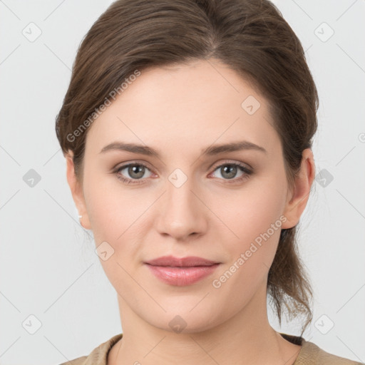 Joyful white young-adult female with medium  brown hair and grey eyes