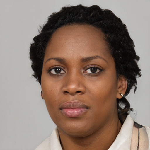 Neutral black young-adult female with short  black hair and brown eyes