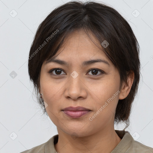 Joyful asian young-adult female with medium  brown hair and brown eyes