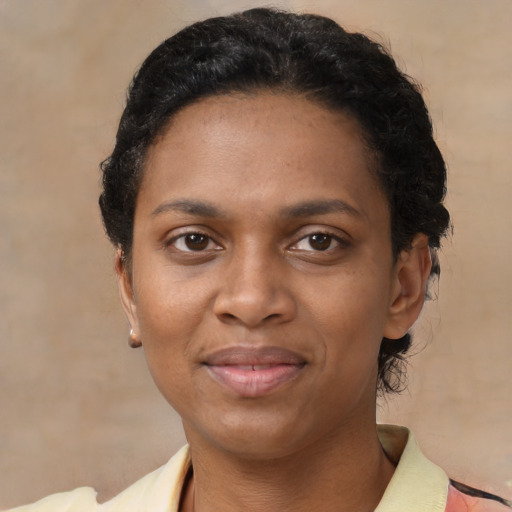 Joyful latino adult female with short  black hair and brown eyes