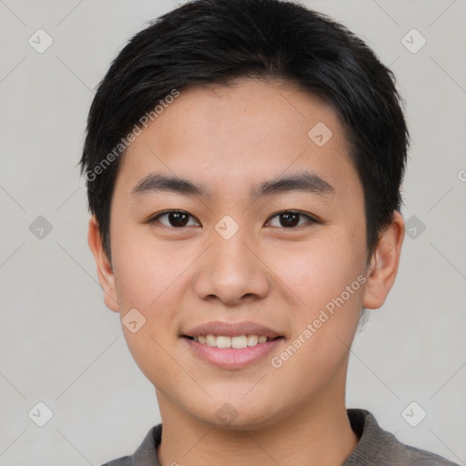 Joyful asian young-adult male with short  black hair and brown eyes