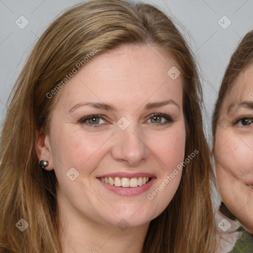 Joyful white young-adult female with long  brown hair and green eyes