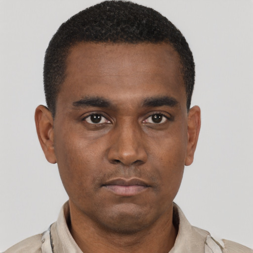 Neutral black young-adult male with short  black hair and brown eyes