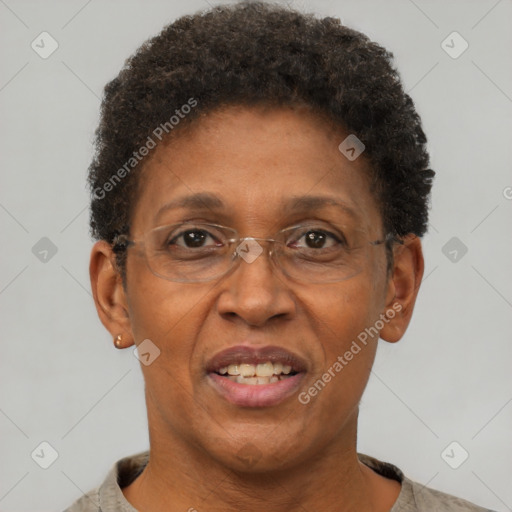 Joyful black adult female with short  brown hair and brown eyes