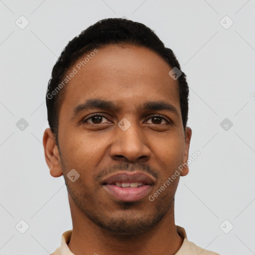 Joyful black young-adult male with short  black hair and brown eyes
