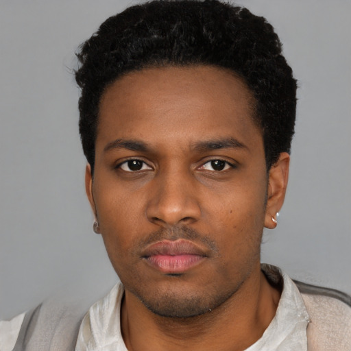 Neutral black young-adult male with short  black hair and brown eyes