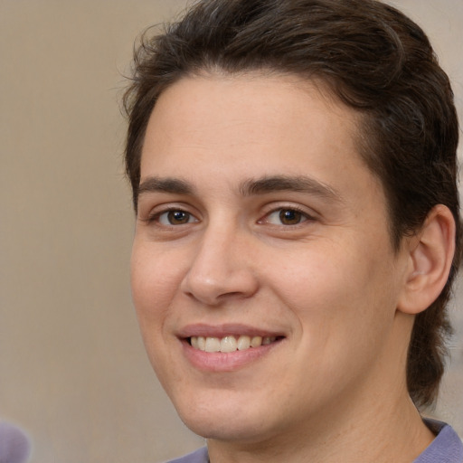 Joyful white young-adult male with medium  brown hair and brown eyes