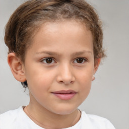 Joyful white child female with short  brown hair and brown eyes