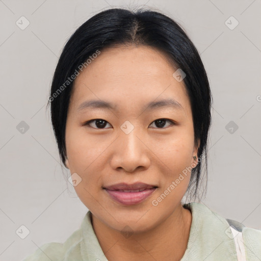 Joyful asian young-adult female with medium  black hair and brown eyes