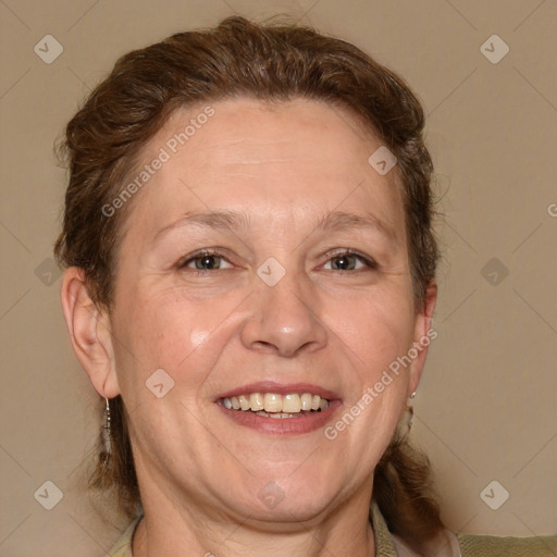 Joyful white adult female with medium  brown hair and blue eyes