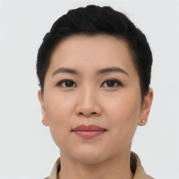 Joyful asian young-adult female with short  brown hair and brown eyes