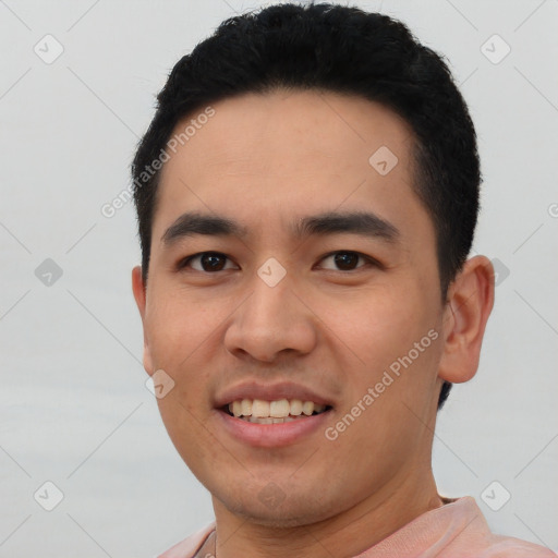 Joyful white young-adult male with short  black hair and brown eyes