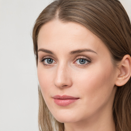 Neutral white young-adult female with long  brown hair and grey eyes