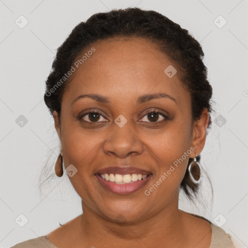 Joyful black young-adult female with short  brown hair and brown eyes