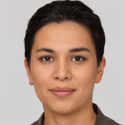 Joyful latino young-adult female with short  brown hair and brown eyes