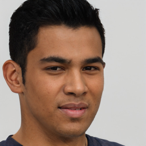 Joyful asian young-adult male with short  brown hair and brown eyes