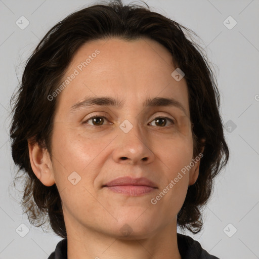 Joyful white adult female with medium  brown hair and brown eyes