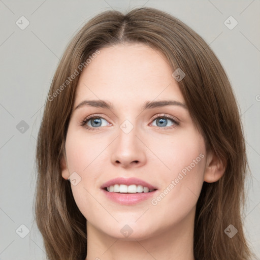 Joyful white young-adult female with long  brown hair and green eyes