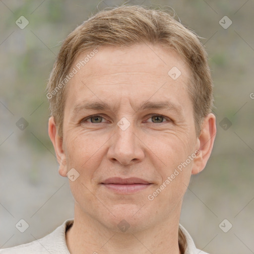 Joyful white adult male with short  brown hair and grey eyes