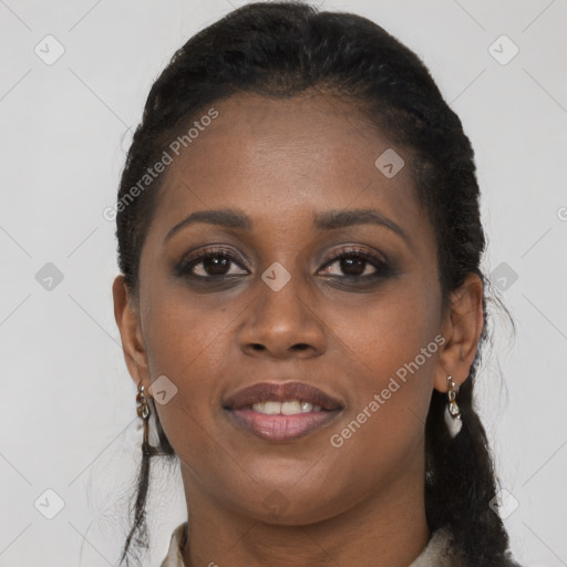 Joyful black young-adult female with long  brown hair and brown eyes
