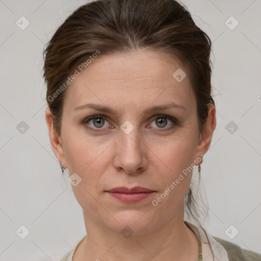 Joyful white adult female with short  brown hair and grey eyes