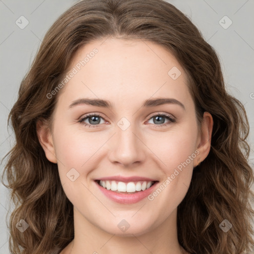 Joyful white young-adult female with long  brown hair and green eyes