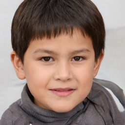 Joyful white child male with short  brown hair and brown eyes