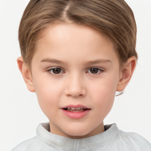 Joyful white child female with short  brown hair and brown eyes