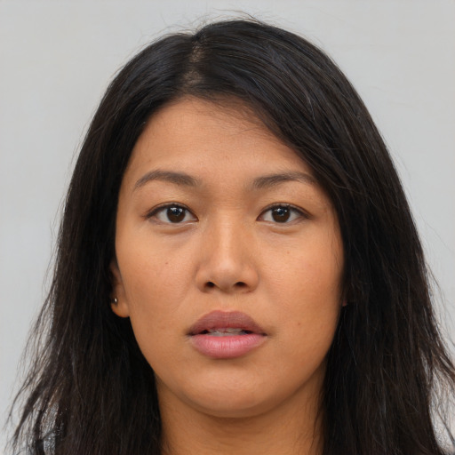 Neutral latino young-adult female with long  brown hair and brown eyes
