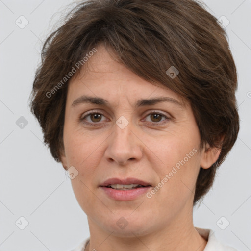 Joyful white adult female with short  brown hair and brown eyes