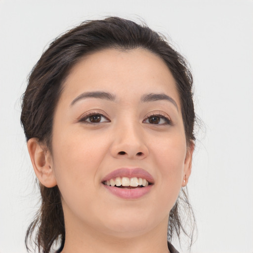 Joyful asian young-adult female with long  brown hair and brown eyes