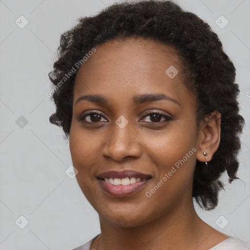 Joyful black young-adult female with medium  black hair and brown eyes