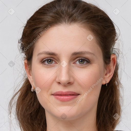 Joyful white young-adult female with long  brown hair and grey eyes