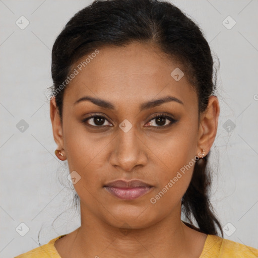 Joyful latino young-adult female with short  brown hair and brown eyes