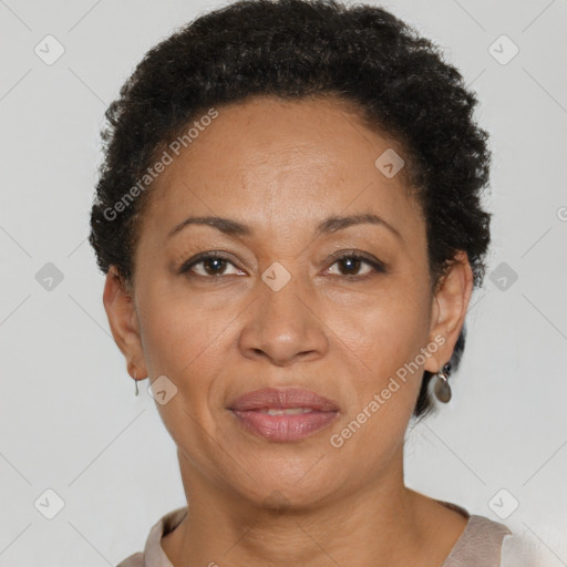 Joyful black adult female with short  brown hair and brown eyes