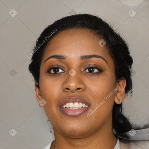 Joyful black young-adult female with long  black hair and brown eyes