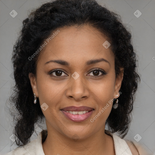 Joyful black young-adult female with medium  brown hair and brown eyes