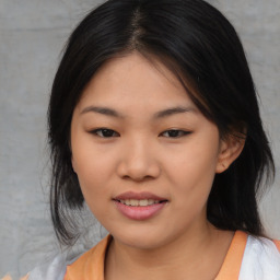 Joyful asian young-adult female with medium  black hair and brown eyes