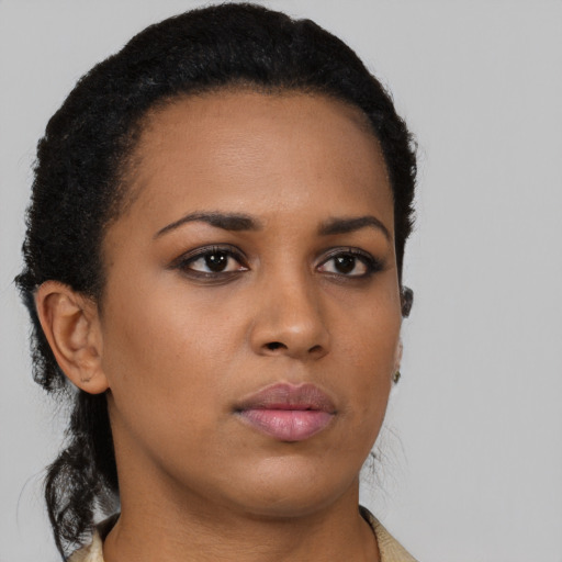 Neutral black young-adult female with short  black hair and brown eyes