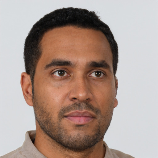 Neutral latino young-adult male with short  brown hair and brown eyes