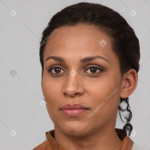 Joyful latino young-adult female with short  brown hair and brown eyes