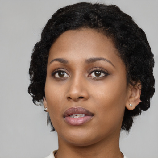 Neutral black young-adult female with short  black hair and brown eyes