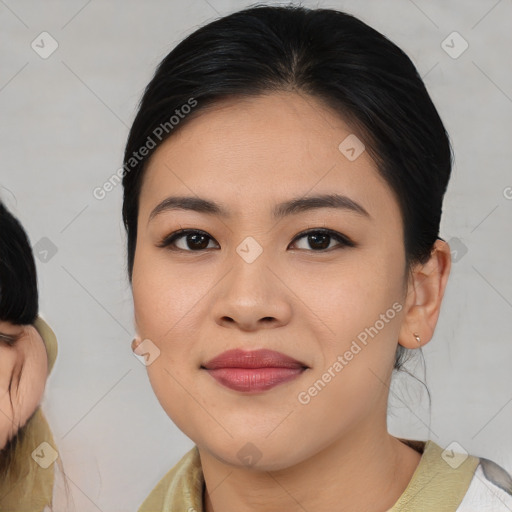 Joyful asian young-adult female with medium  black hair and brown eyes