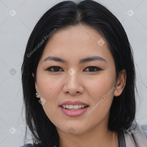 Joyful asian young-adult female with medium  black hair and brown eyes