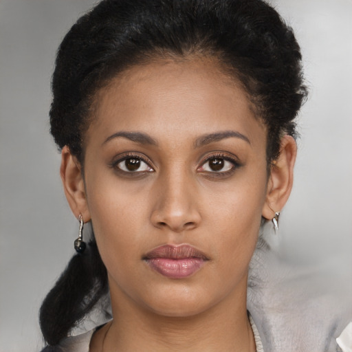 Neutral black young-adult female with medium  brown hair and brown eyes