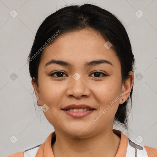 Joyful latino young-adult female with medium  brown hair and brown eyes