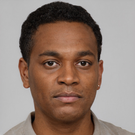 Neutral black young-adult male with short  black hair and brown eyes